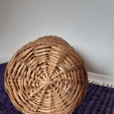 Old high wicker glass bottle