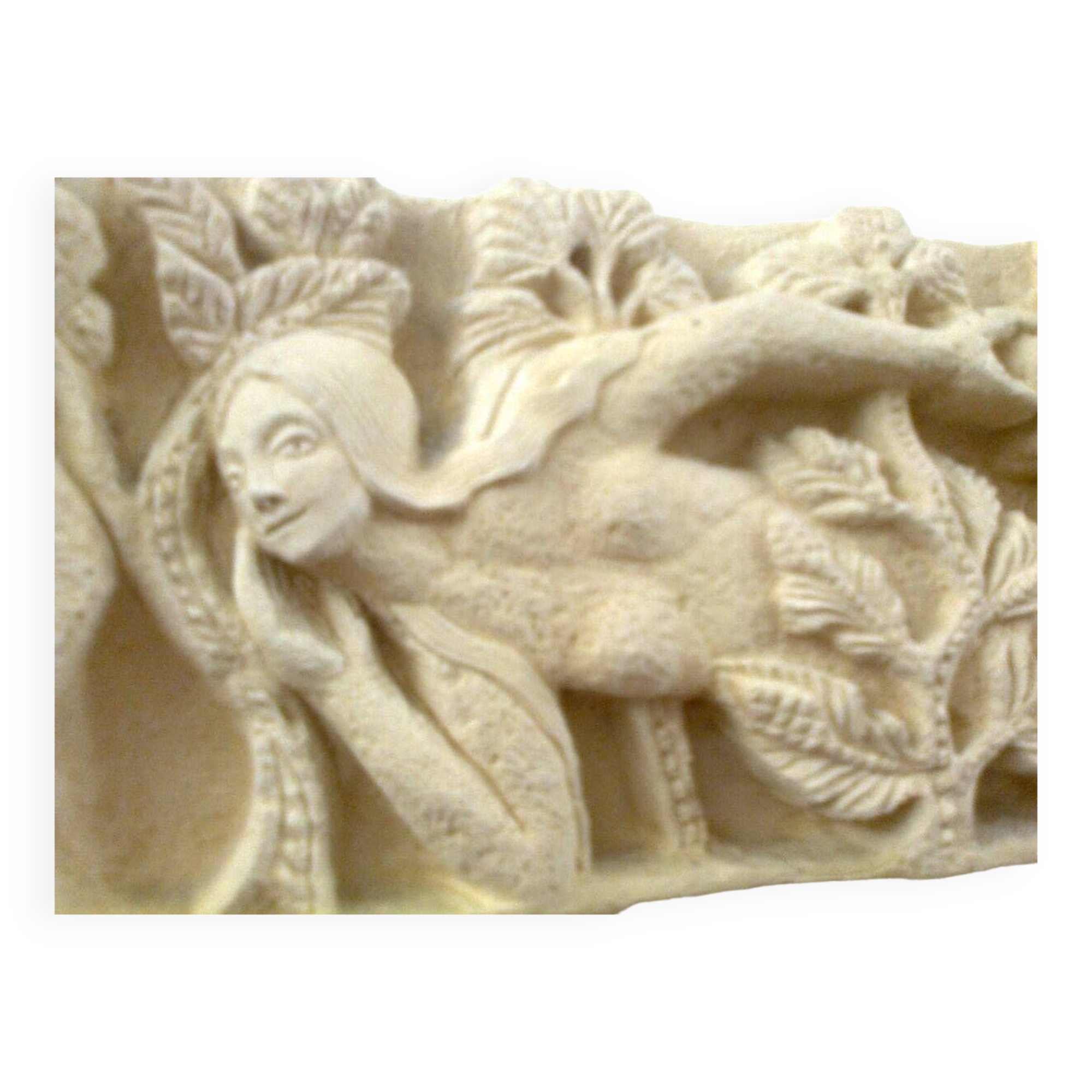 Sculpted stone wall decoration, medieval motif: Eve in the Garden of Eden