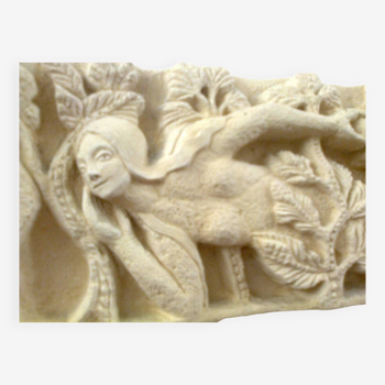 Sculpted stone wall decoration, medieval motif: Eve in the Garden of Eden