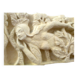 Sculpted stone wall decoration, medieval motif: Eve in the Garden of Eden