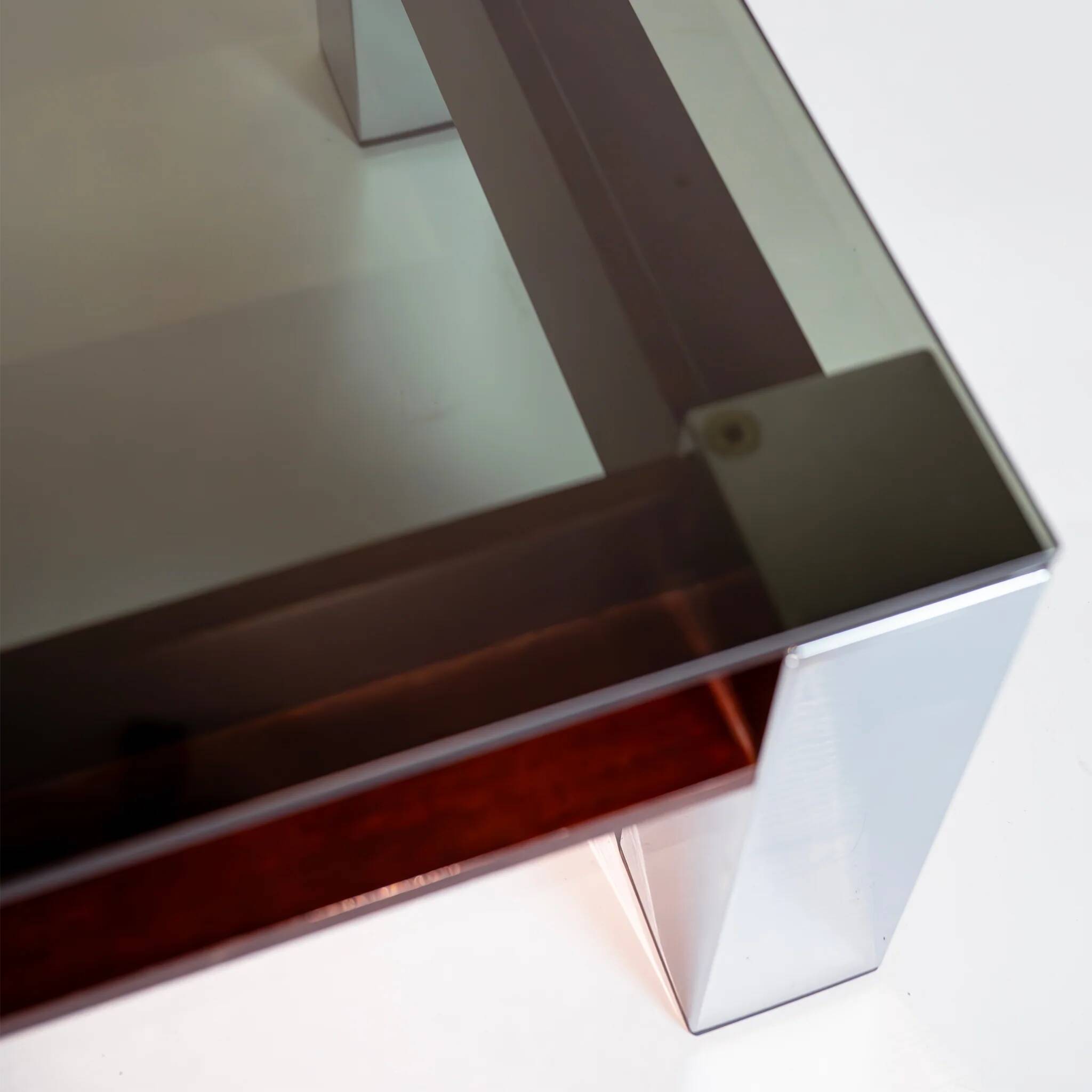 Vintage Italian coffee table with a smoked glass top and chrome structure.