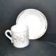 Paris porcelain coffee cup with floral design, antique porcelain with gold trim.