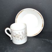 Paris porcelain coffee cup with floral design, antique porcelain with gold trim.