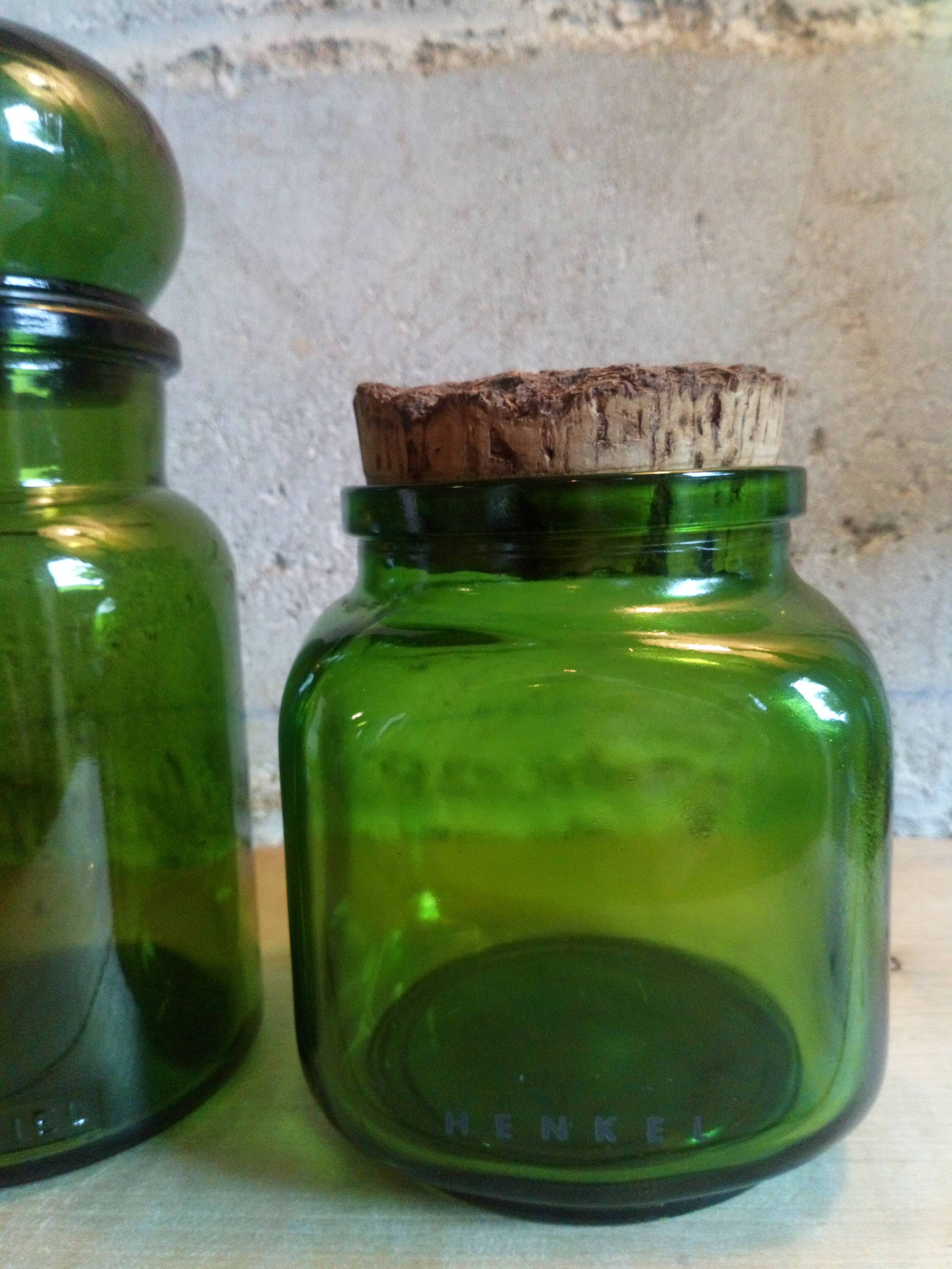 Trio of green glass apothecary bottles