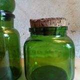 Trio of green glass apothecary bottles