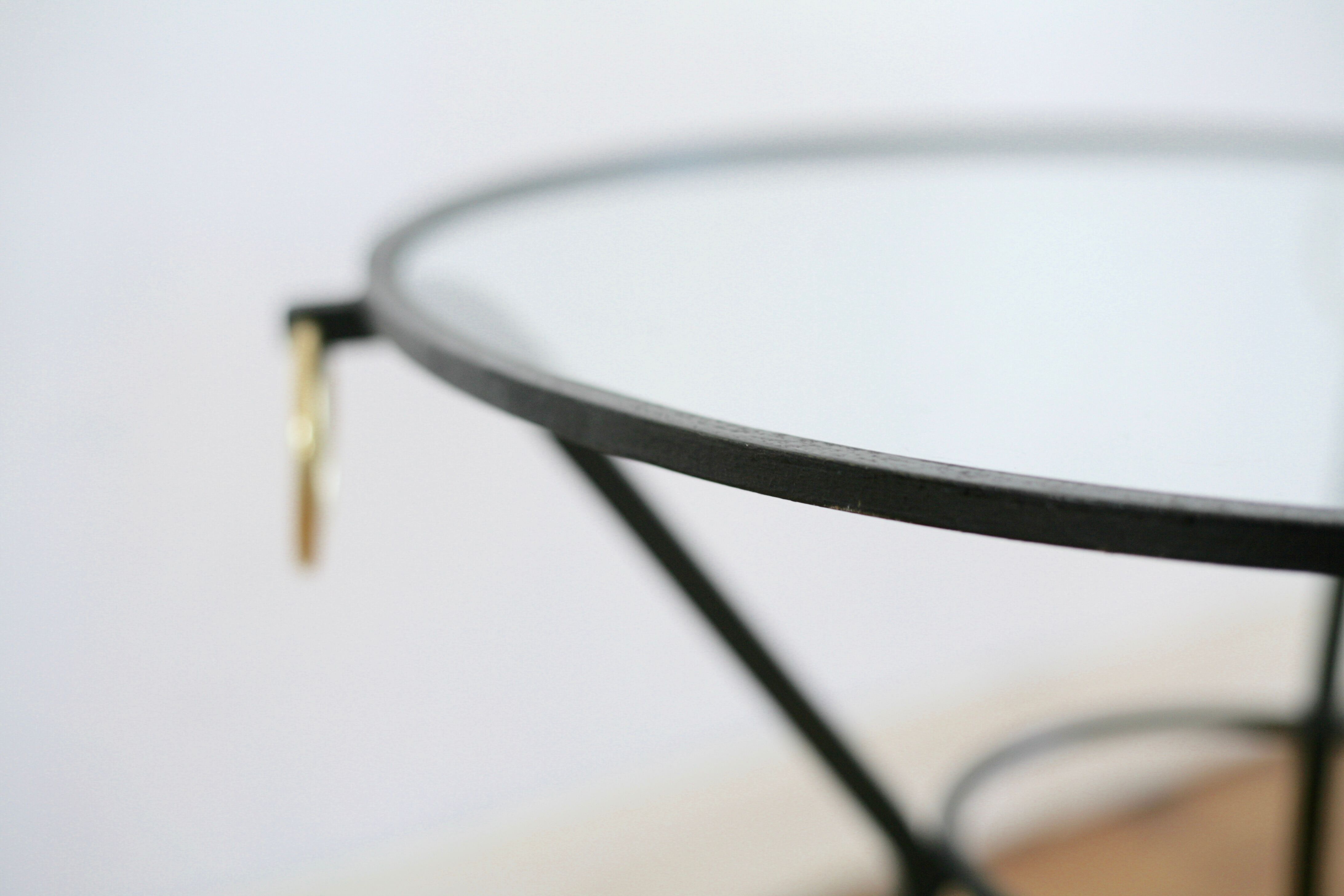 Coffee table black lacquered metal, glass and brass, France, circa 1950.