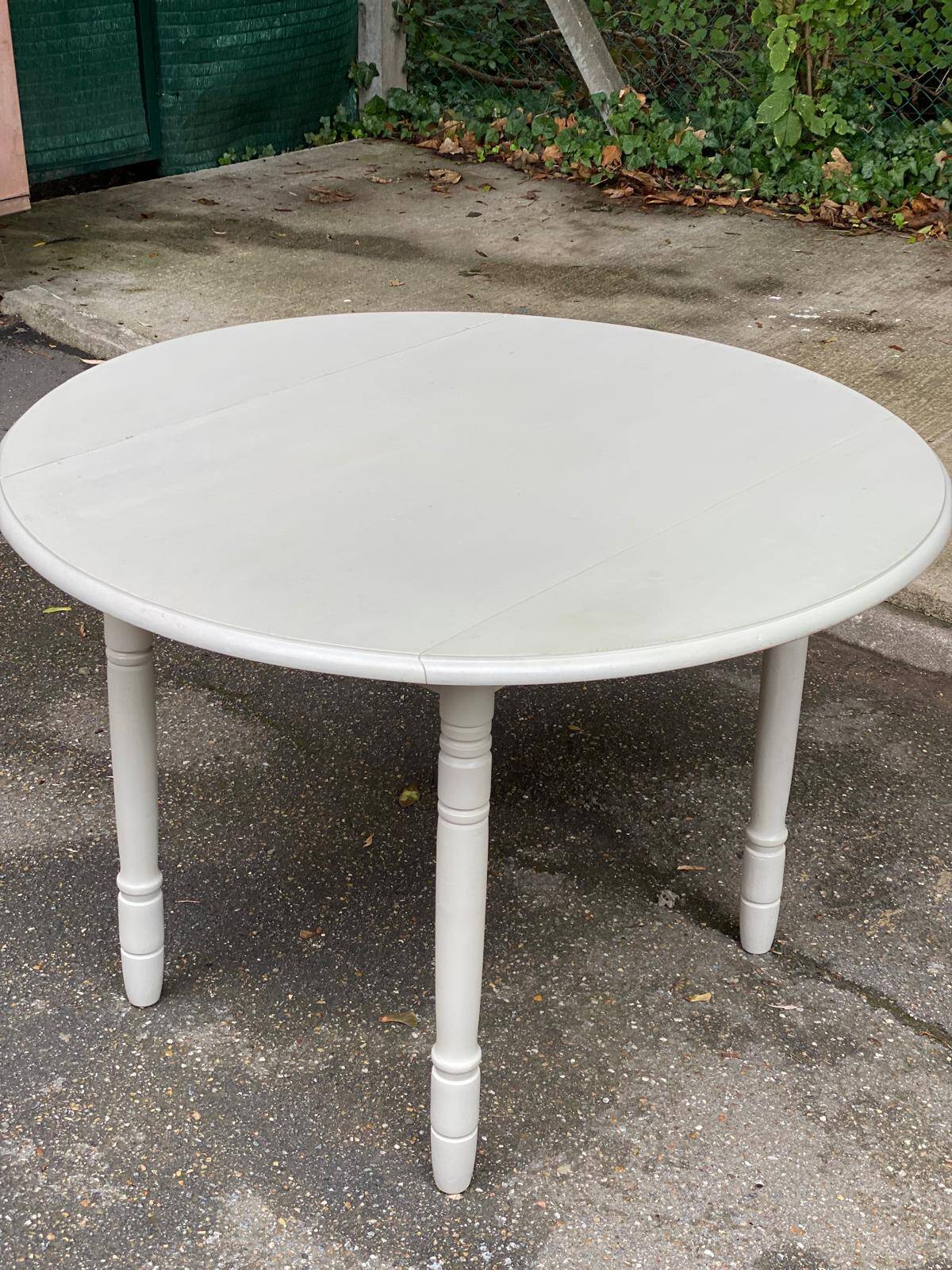 Louis Philippe round dining table with folding shutters repainted in beige grey