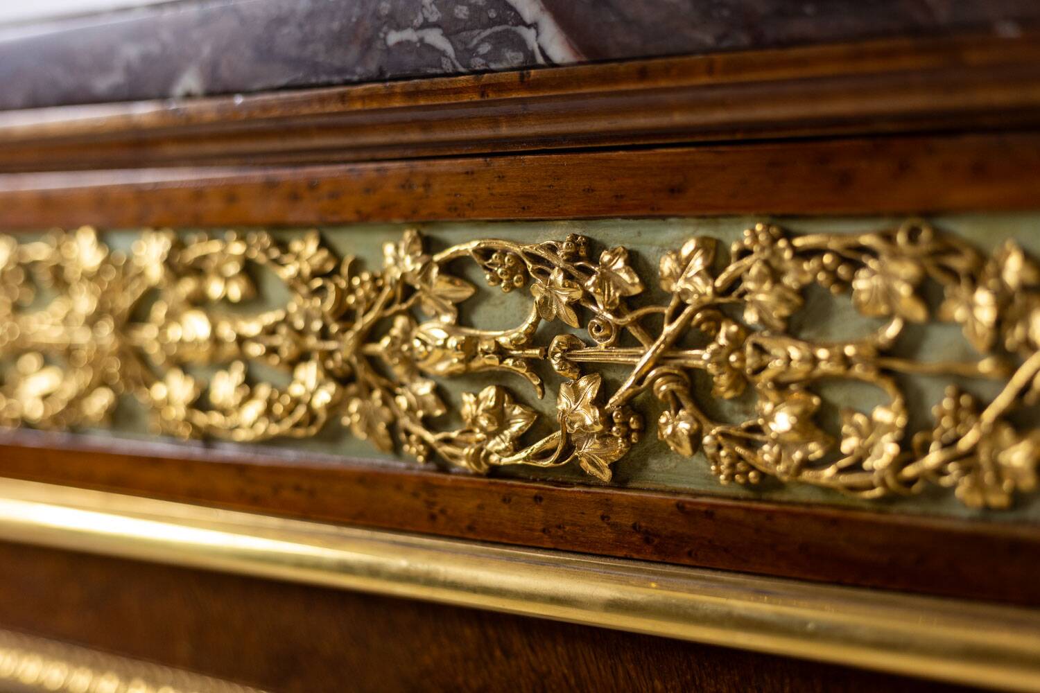 Empire style chest of drawers in lacquer, bronze and marble. Nineteenth century.