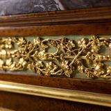 Empire style chest of drawers in lacquer, bronze and marble. Nineteenth century.