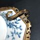 Blue Chinese floral porcelain coupe on a bronze base table centrepiece.