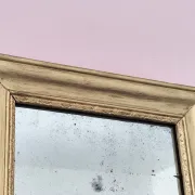 Small Art Deco mirror with a gilded wooden frame.