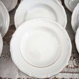 12 deep plates in porcelain with double gold trim.