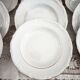12 deep plates in porcelain with double gold trim.
