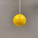 Spherical pendant lamp in sunny yellow.