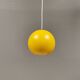 Spherical pendant lamp in sunny yellow.