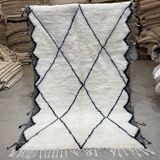 White wool rug with framing