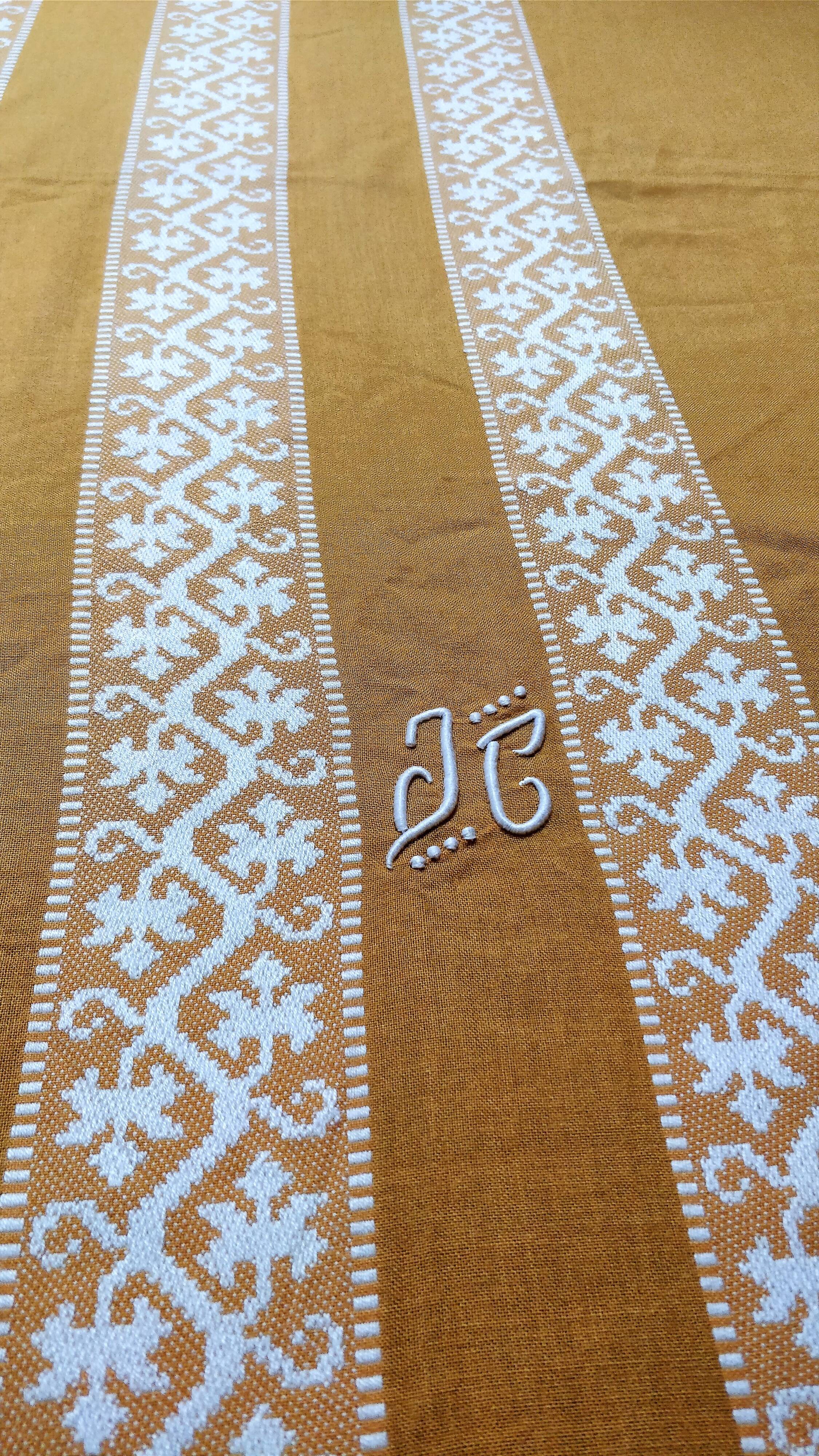 Mustard yellow tablecloth with towels