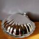 Shell-shaped butter dish in stainless steel