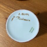 Hand-painted Limoges porcelain cup and saucer signed R. Blier
