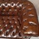 Upholstered chesterfield brown sofa