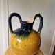 Pottery, jar, old jug in yellow and green glazed terracotta