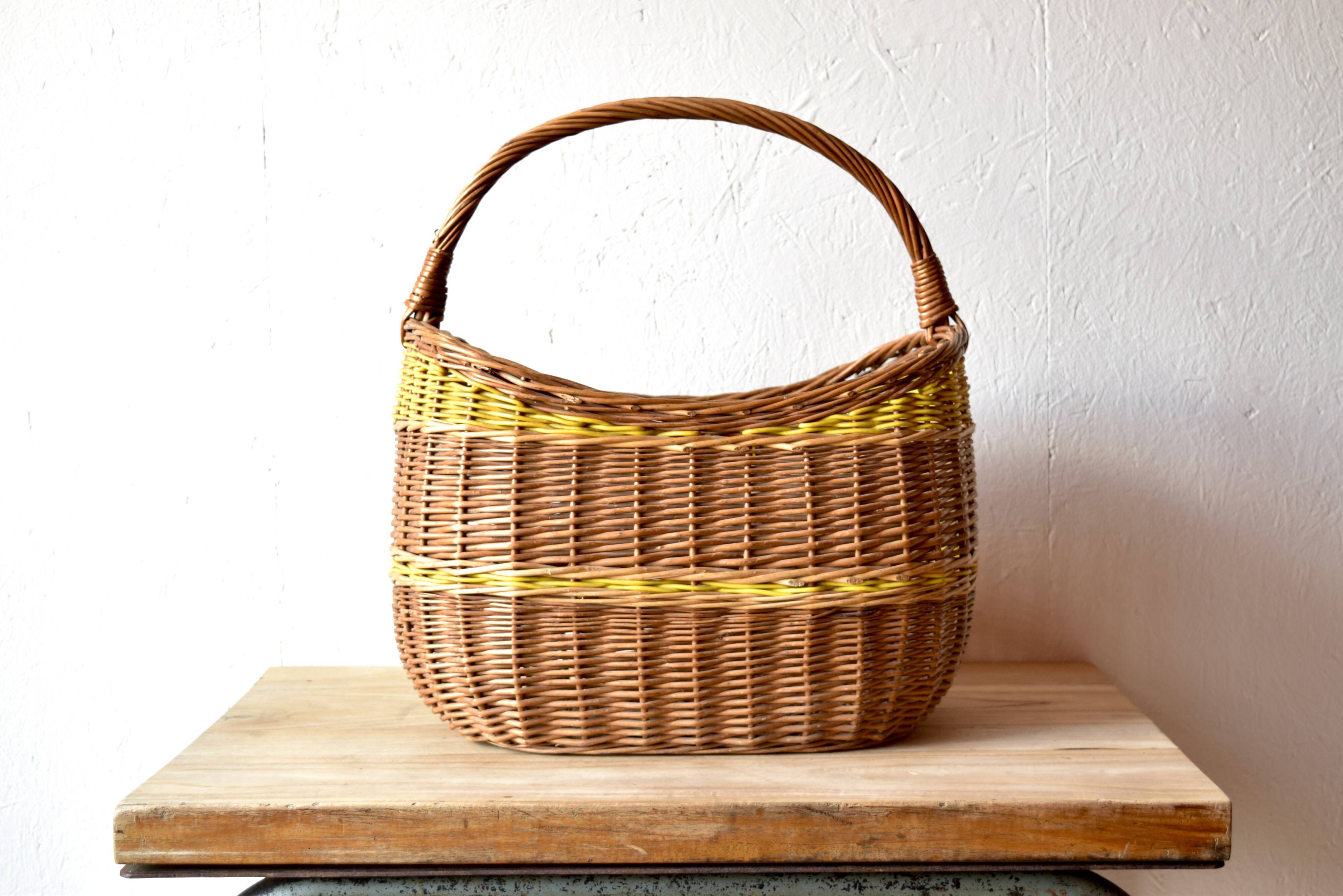 Vintage wicker basket crossed with a yellow scoubidou