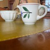 Old porcelain milk jug with barbel decoration