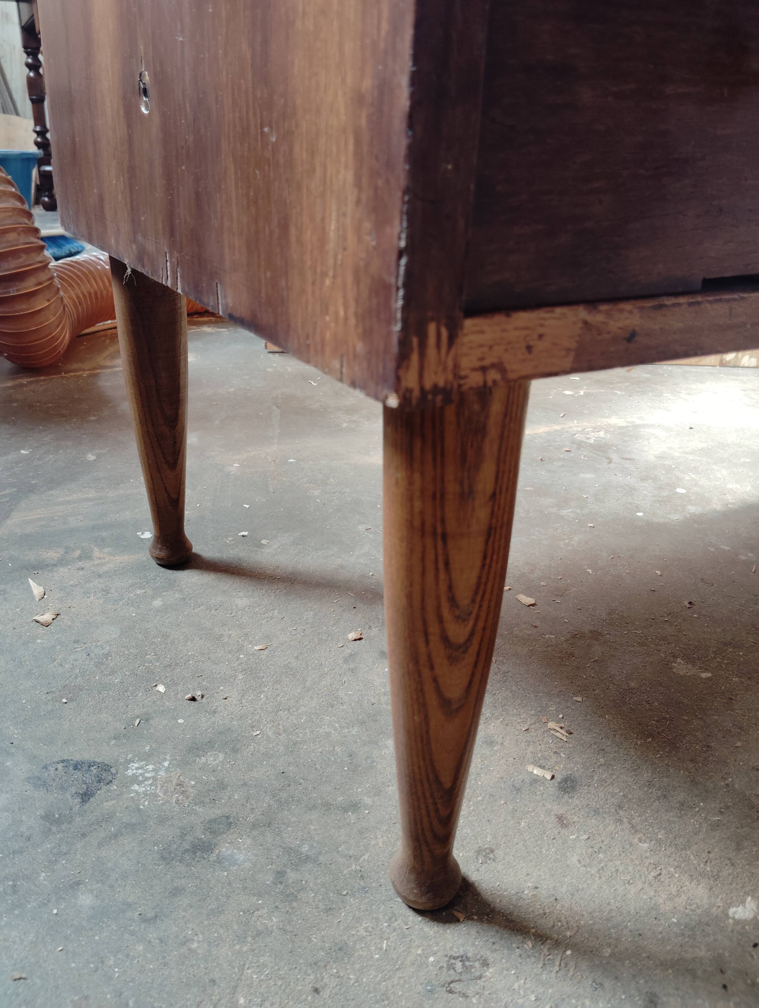 Vintage commode with tapered legs.