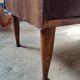 Vintage commode with tapered legs.