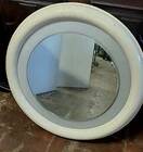 1970s mirror with integrated lighting, futuristic design, vintage wood.