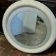 1970s mirror with integrated lighting, futuristic design, vintage wood.