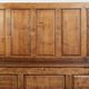 Antique English oak hall bench from the early 19th century with storage space