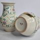 Pair of hand decorated enamelled ceramic vases, 13 cm