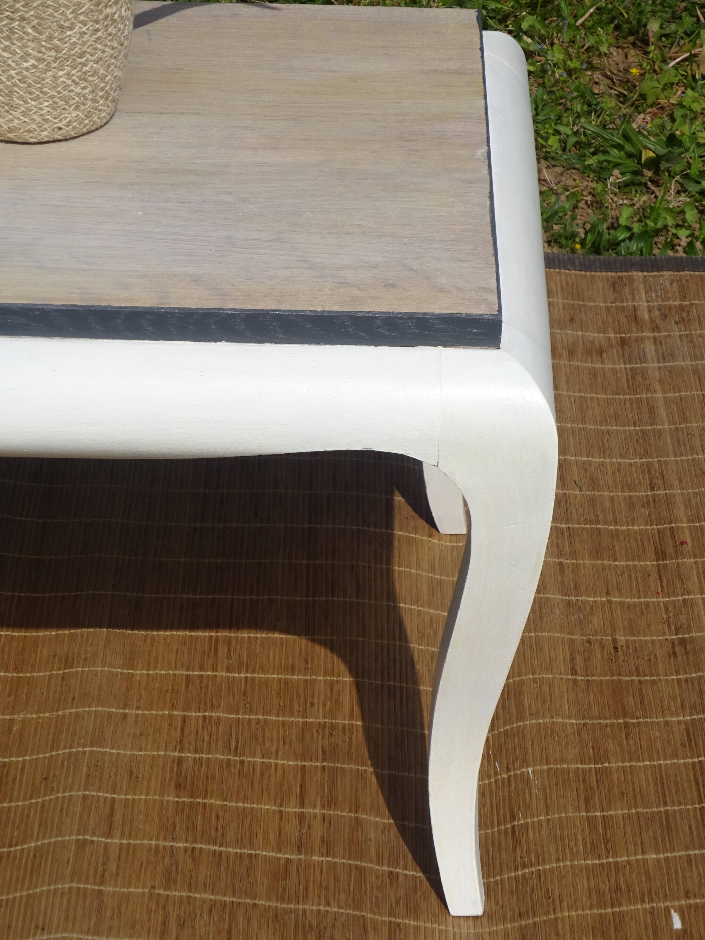 Oak coffee table with curved legs.
