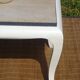 Oak coffee table with curved legs.