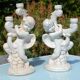 Pair of "cherub" candle holders in plaster