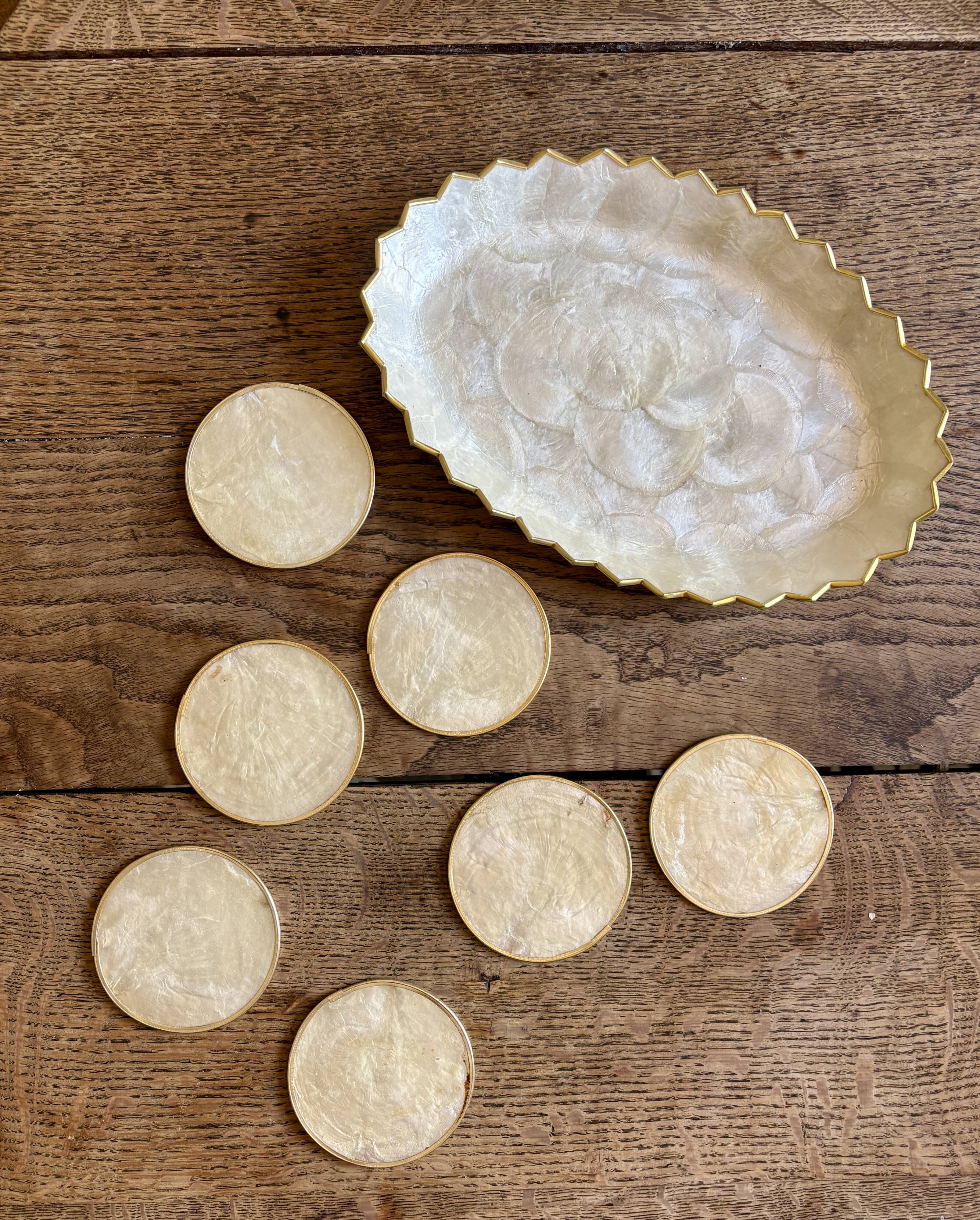 Lot of mother-of-pearl aperitif items, 7 coasters and a dish.