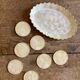 Lot of mother-of-pearl aperitif items, 7 coasters and a dish.