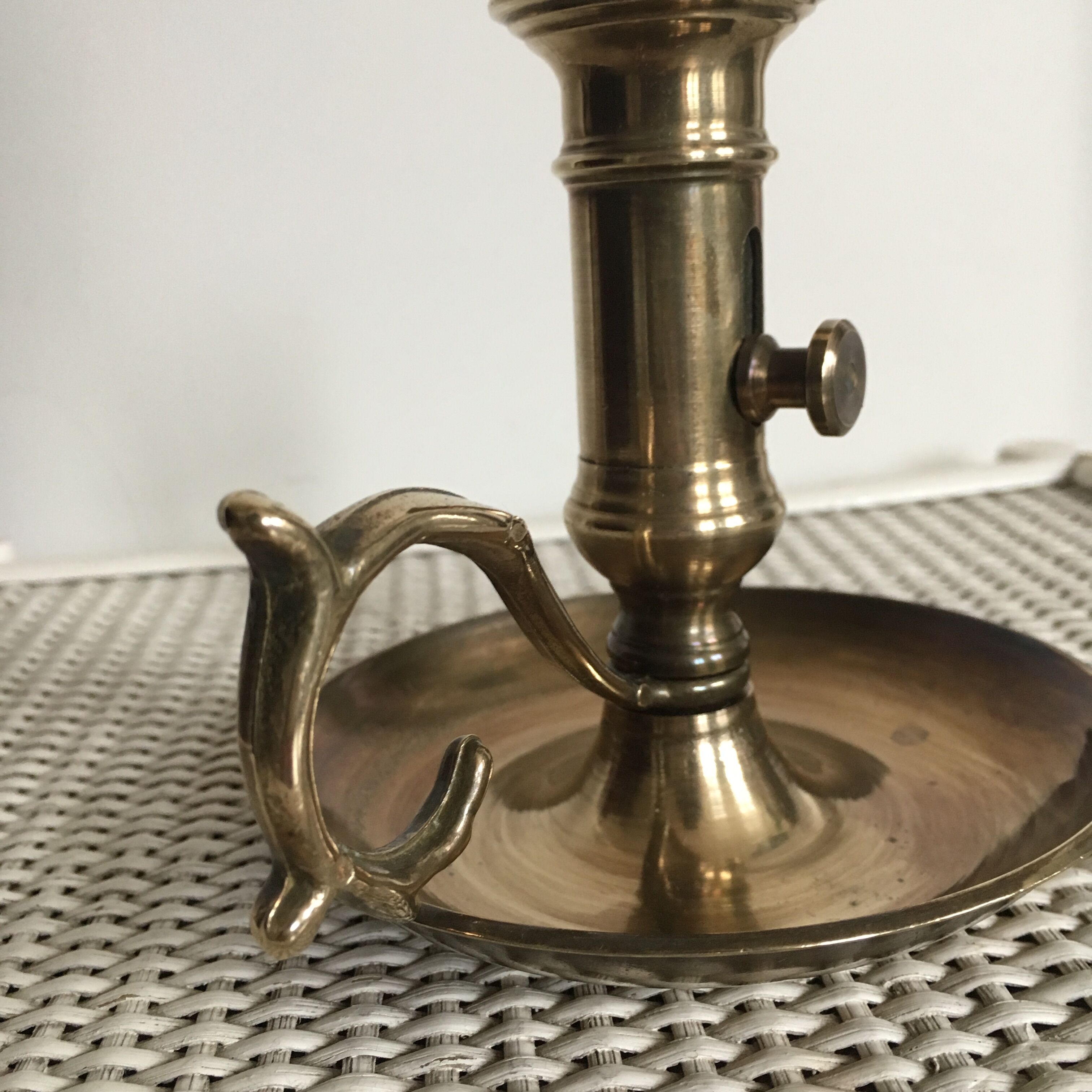 Old brass candlestick called "rat tail"