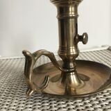 Old brass candlestick called "rat tail"