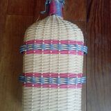 Glass and wicker bottle