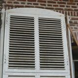 Wooden persian shutter with an opening