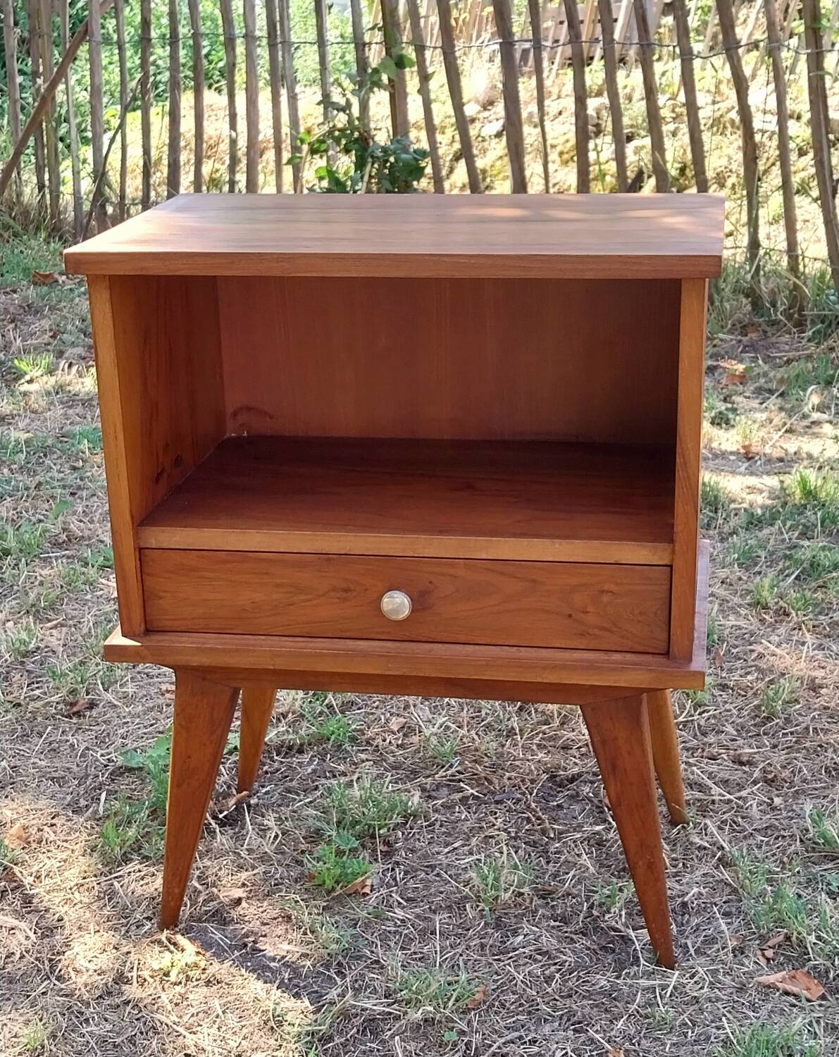 Wooden bedside table with compass feet