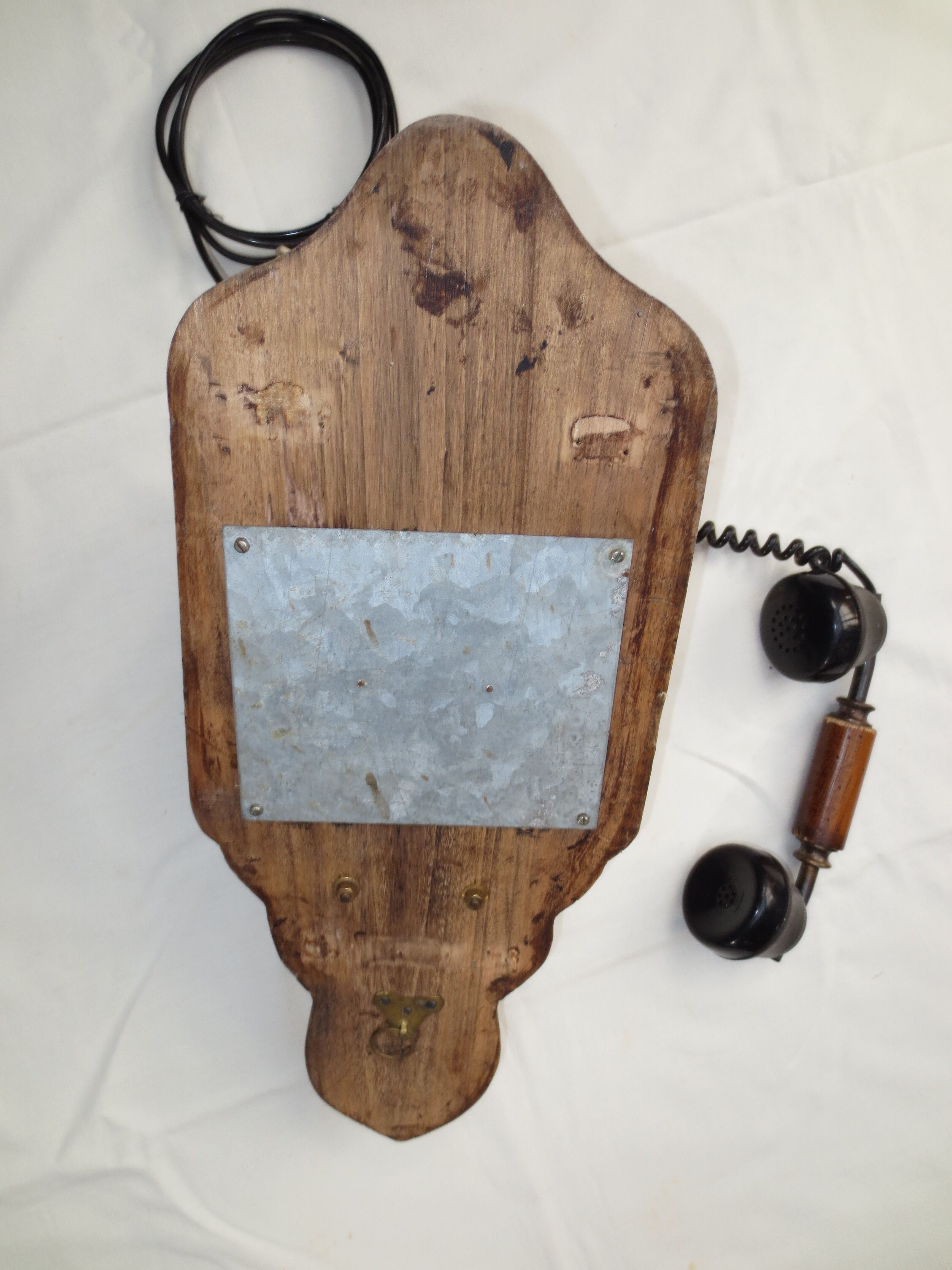 Old wood and metal wall phone