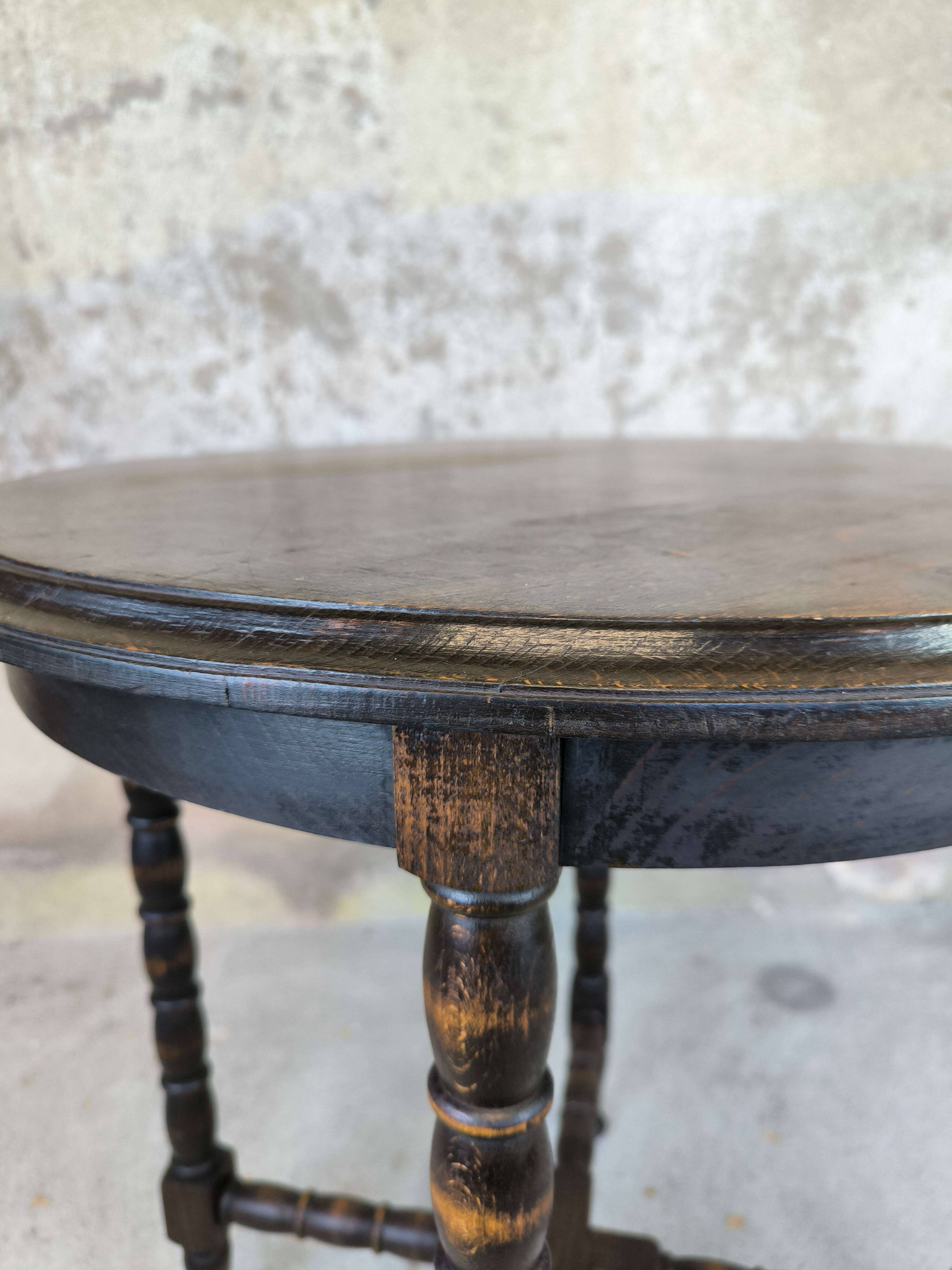 Vintage gueridon with beaded wooden legs.