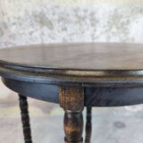 Vintage gueridon with beaded wooden legs.