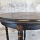 Vintage gueridon with beaded wooden legs.