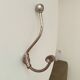 Antique steel wall-mounted coat rack
