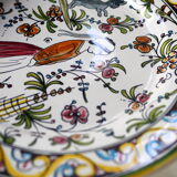 Decorative plate with medieval, Breton and rabbit decoration surrounded by plants - Breton earthenware