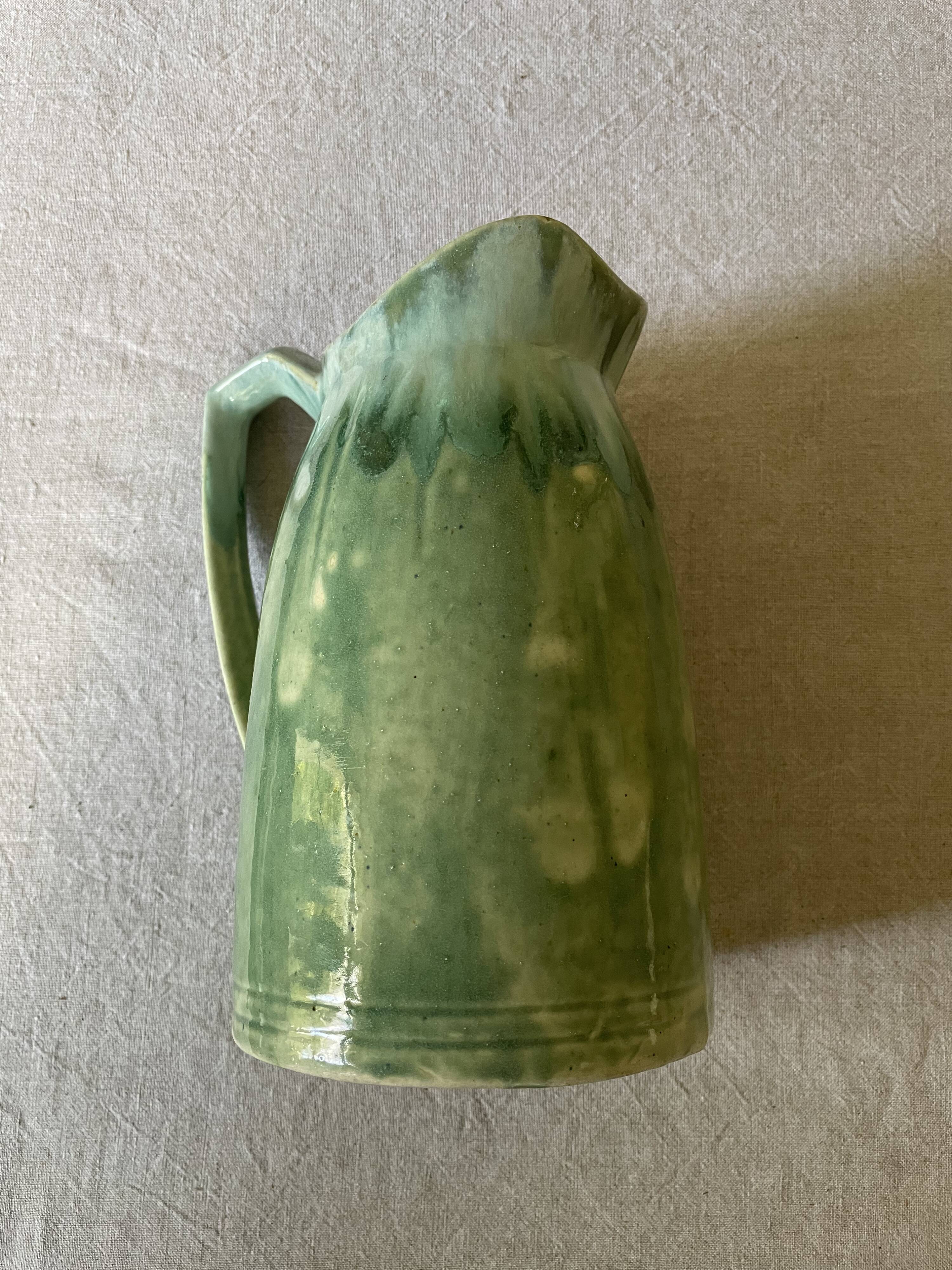 Turquoise green enamelled ceramic pitcher